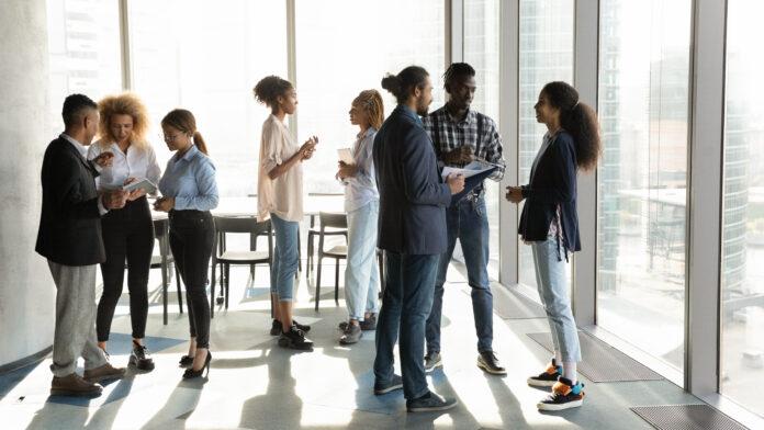 full-length-motivated-millennial-african-american-colleagues-employees-managers-communicating-in-small-groups-enjoying-break-time-in-modern-office-room-networking-enjoying-teambuilding-activity-stockpack-adobe-stock Full length motivated millennial african american colleagues employees managers communicating in small groups, enjoying break time in modern office room, networking enjoying teambuilding activity