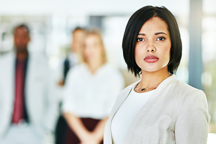 serious-focused-and-confident-female-lawyer-looking-at-the-camera-and-standing-in-her-office-with-her-team-portrait-of-a-leader-smart-and-intelligent-attorney-that-is-tough-and-resilient-stockpack-adobe-stock Serious, focused and confident female lawyer looking at the camera and standing in her office with her team. Portrait of a leader, smart and intelligent attorney that is tough and resilient