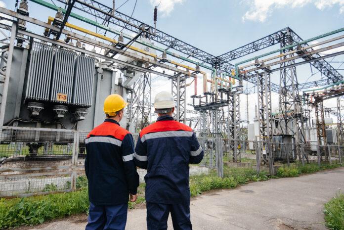 two-specialist-electrical-substation-engineers-inspect-modern-high-voltage-equipment-energy-industry-stockpack-adobe-stock Two specialist electrical substation engineers inspect modern high-voltage equipment. Energy. Industry