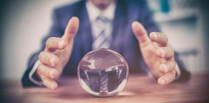 Businessman forecasting a crystal ball