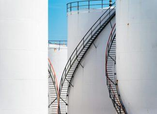 European Governments Combat Rising Fuel Costs Amid Iran Crisis Industrial oil storage tanks representing European fuel supply infrastructure amid rising energy costs