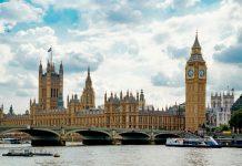London Metal Exchange Trading Suspended After Tech Disruption Electronic trading screens showing commodity prices and market data on metals exchange trading floor