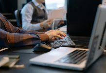 WorkTok Movement Shows Young Irish Workers Reshaping Work Culture Young professionals in modern Irish office space sharing workplace experiences through social media