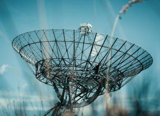 Amazon Pursuing Acquisition of Globalstar to Challenge Starlink Satellite communications network infrastructure representing Amazon's expansion into global telecommunications sector