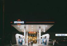 Analysis: Are Irish Fuel Retailers Guilty of Price Gouging? Irish petrol station forecourt showing fuel price display with cars refueling