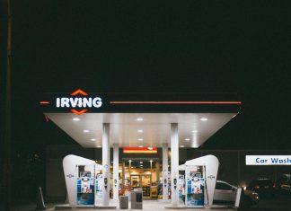 Analysis: Are Irish Fuel Retailers Guilty of Price Gouging? Irish petrol station forecourt showing fuel price display with cars refueling