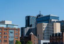 Belfast Software Firm Craxel Announces 27 New Technology Roles Modern technology office building in Belfast representing software industry growth and employment opportunities