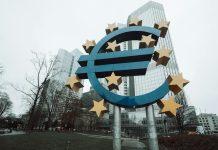 Central Banks Pause Rate Decisions Amid Middle East War Concerns Central bank monetary policy decision making meeting room with officials discussing economic conditions and interest rates