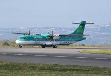 Irish Holiday Travel: Hidden Costs and Alerts for Summer 2024 Passengers at Dublin Airport departure terminal preparing for summer holiday travel with luggage and boarding passes