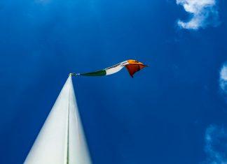 Opposition Parties Demand Three Additional Bank Holidays for Ireland Irish workers discussing workplace benefits and bank holiday entitlements in modern office environment