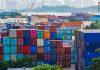US Trade Deficit Expansion Signals Broader Economic Shifts International shipping containers representing global trade flows and economic activity between United States and Ireland