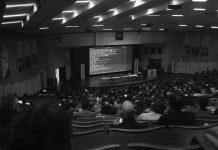 Web Summit Contests Breach of Contract Claim Over Qatar Event Technology conference stage with speakers at corporate event venue representing Web Summit dispute